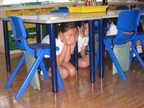 Children participating in an earthquake drill on April 23, 2009, at the British School in Tokyo.