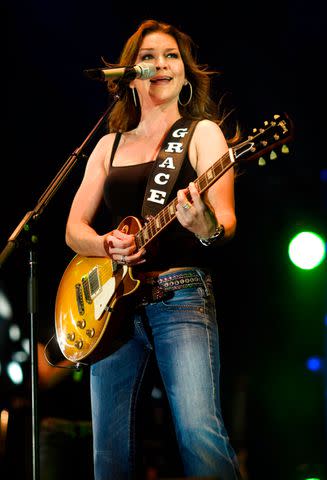 <p>Paul Natkin/Getty</p> Gretchen Wilson performing in Chicago in October 2008