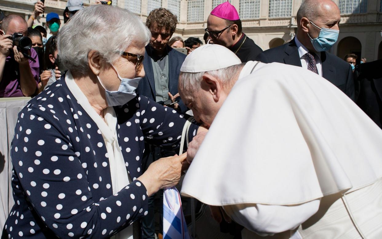 Pope Francis kisses the Auschwitz serial number tattoo on the arm of Holocaust survivor Lidia Maksymowicz - Vatican Media 