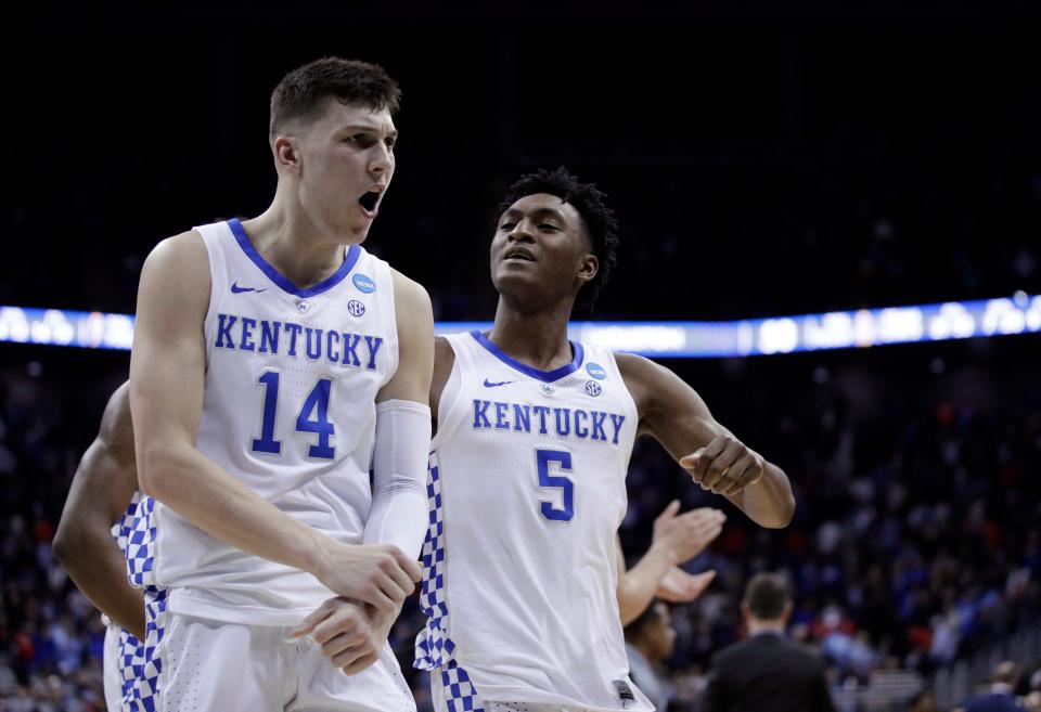 Kentucky's Tyler Herro (14) and Immanuel Quickley celebrate following a NCAA TournamentMidwest Regional semifinal game against Houston Friday, March 29, 2019, in Kansas City, Mo.