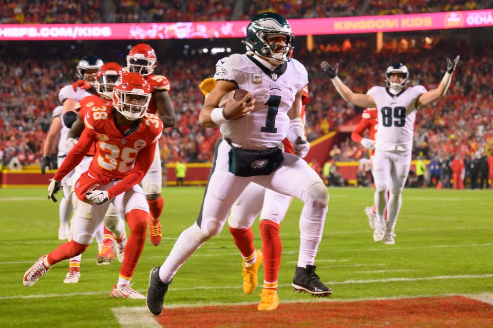 Philadelphia Eagles quarterback Jalen Hurts (1) runs into the end zone for a touchdown against the Kansas City Chiefs during the second half of an NFL football game, Monday, Nov. 20, 2023 in Kansas City, Mo.