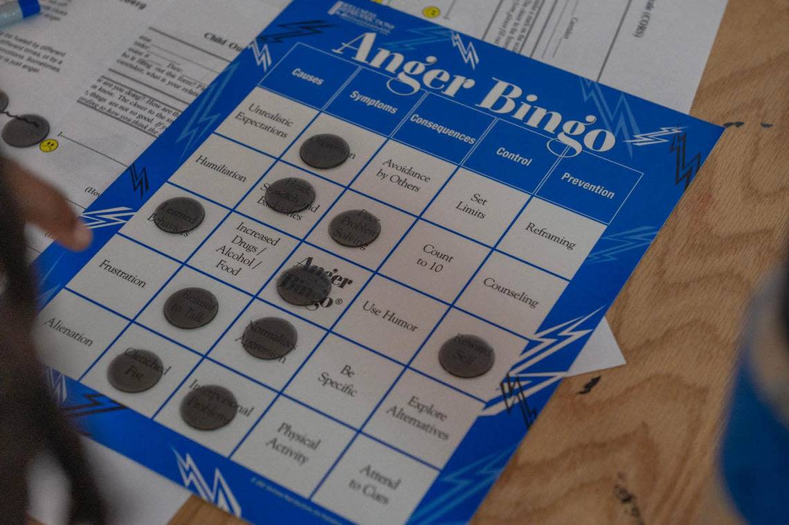 Guest and residents play anger bingo during summer camp at Newhouse on Tuesday, June 20, 2023, in Kansas City.