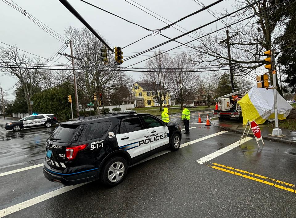 Taunton police Sgt. Kevin Medas is seen here on April 4 talking to a traffic control officer at the intersection of Winthrop and Highland streets following a crash that knocked out a traffic light control box.