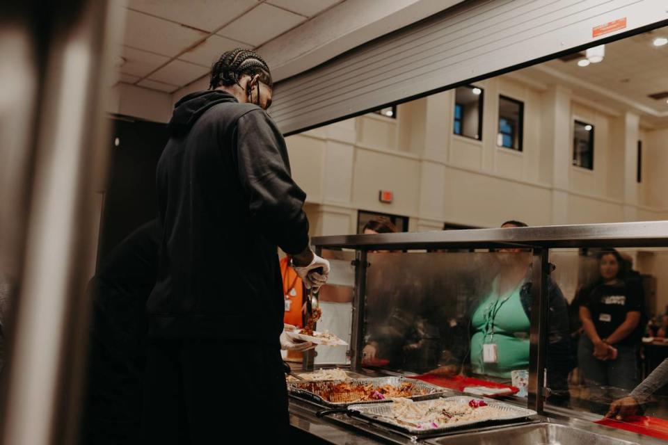 Jalen McDaniels joined volunteers earlier this month to serve dinner to families in need at Dove’s Nest-Charlotte Rescue Mission.