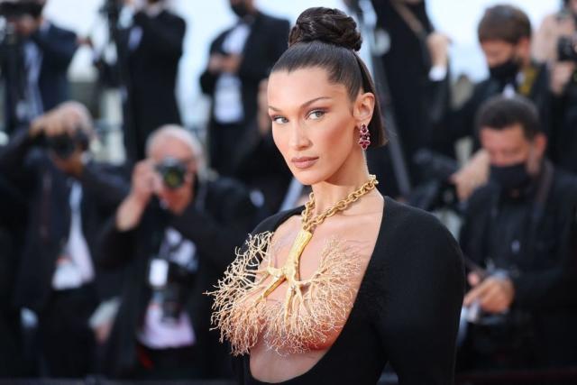 Bella Hadid's assets nearly spill out of tight boob-baring top as she  cheers on team, Celebrity News, Showbiz & TV