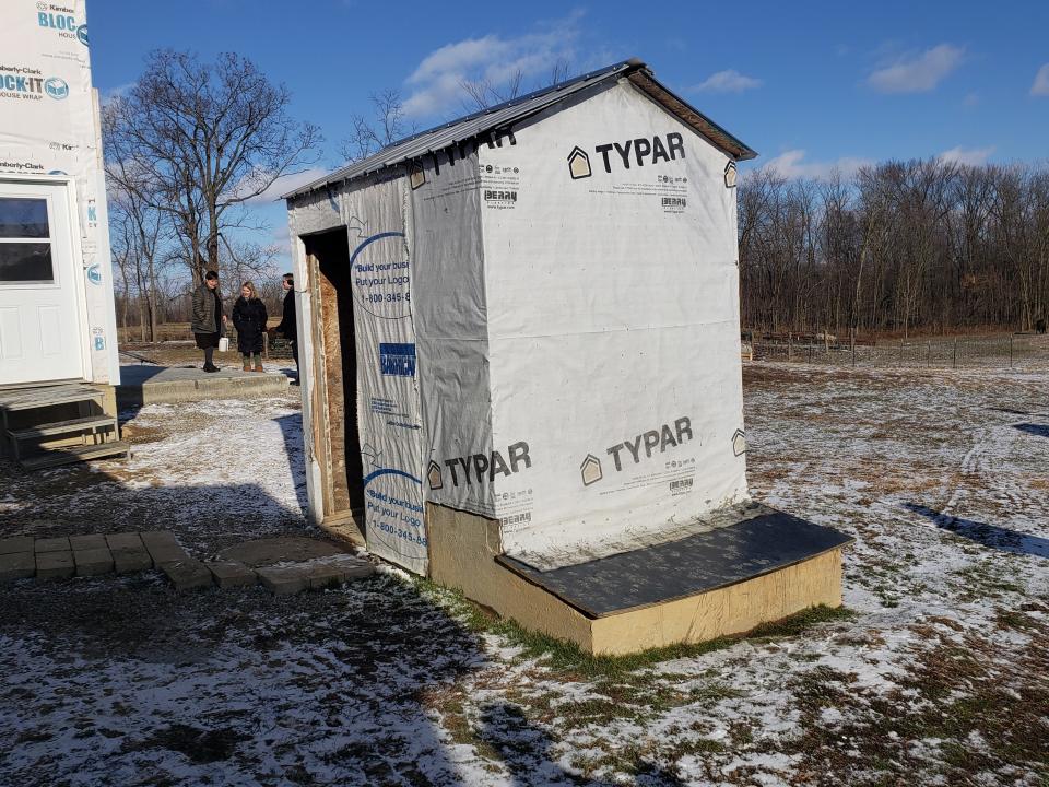 An outhouse is pictured in 2019 on an Amish family's property at 9253 Ranger Highway near Morenci. Lenawee County settled several lawsuits Wednesday against the county’s Amish community over their refusal to install septic systems due to their religious obligations.