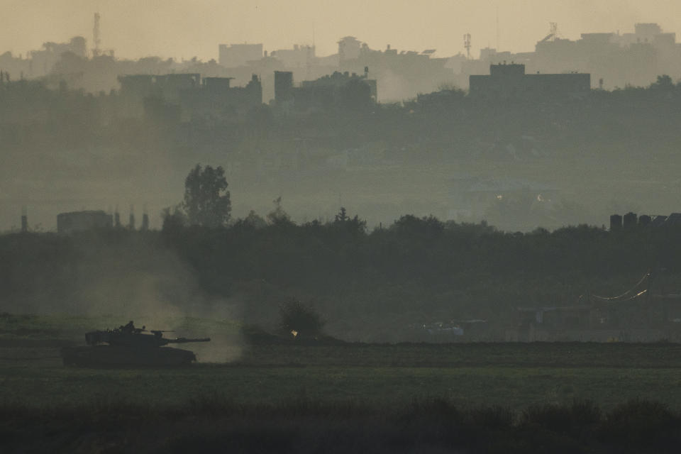 An Israeli tank moves inside the Gaza Strip as seen from southern Israel, Tuesday, Jan. 16, 2024. (AP Photo/Leo Correa)