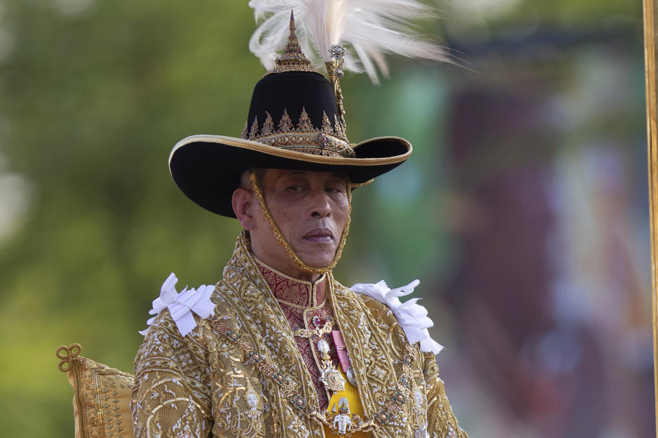 Thailand's King Maha Vajiralongkorn is carried on a palanquin through the streets outside the Grand Palace for the public to pay homage during the second day of his coronation ceremony in Bangkok, Sunday, May 5, 2019. Vajiralongkorn was officially crowned Saturday amid the splendor of the country's Grand Palace, taking the central role in an elaborate centuries-old royal ceremony that was last held almost seven decades ago.(AP Photo/Wason Wanichorn)