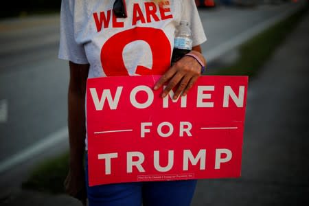 FILE PHOTO: A supporter of U.S. President Donald Trump holds a sign reading "Women for Trump" in Clearwater