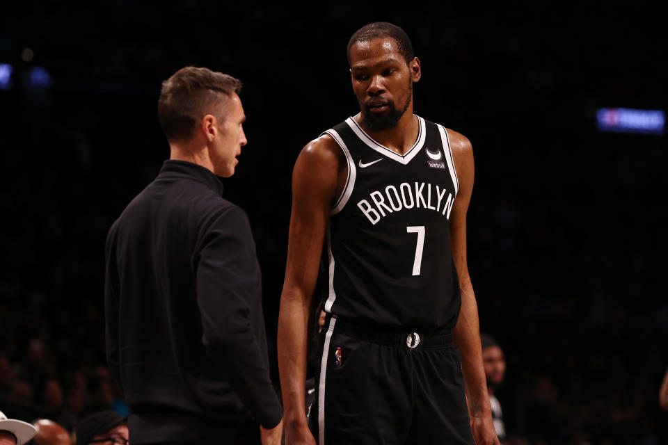 Steve Nash and Kevin Durant #7 of the Brooklyn Nets look on against the Charlotte Hornets at Barclays Center on March 27, 2022 in New York City. NOTE TO USER: User expressly acknowledges and agrees that, by downloading and or using this photograph, User is consenting to the terms and conditions of the Getty Images License Agreement. (Photo by Mike Stobe/Getty Images)