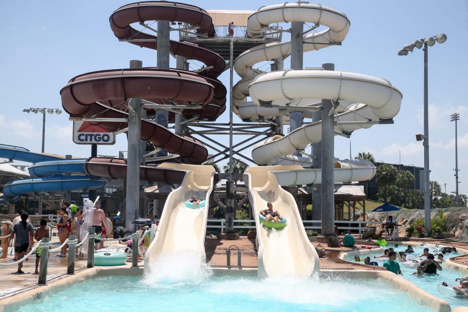 Guests slide down the Cat 5 water slide at Hurricane Alley Waterpark Saturday, May 28, 2022.