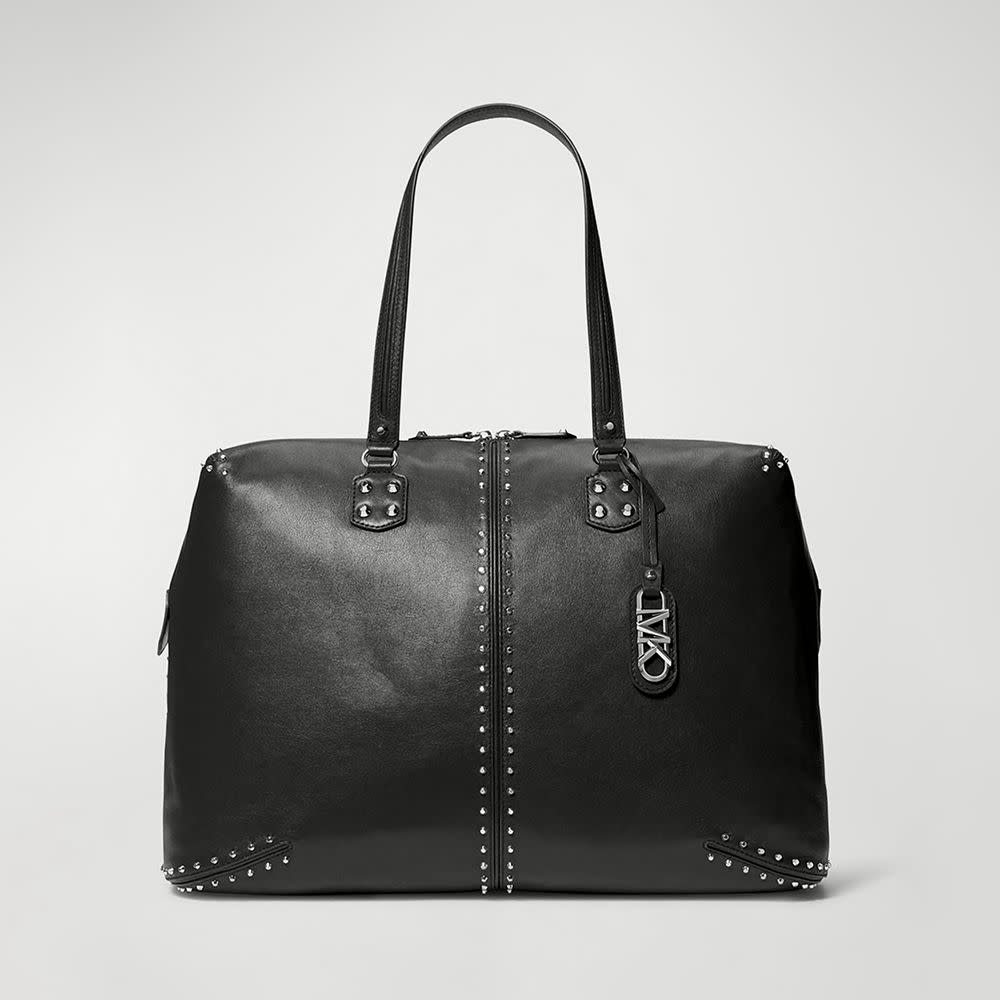 <p><a href="https://go.redirectingat.com?id=74968X1596630&url=https%3A%2F%2Fwww.neimanmarcus.com%2Fp%2Fmichael-michael-kors-xl-weekender-studded-leather-weekender-bag-prod264420337%3FpimId%3D401232285683%26ecid%3DNMCS_GP_NC%26gad_source%3D1%26gclid%3DCjwKCAjw8diwBhAbEiwA7i_sJc79HDWYUyumjQcgMY1QLVTawCkjW8bblaj4ET7ffEM0sfkHkG3-KBoCERYQAvD_BwE%26gclsrc%3Daw.ds&sref=https%3A%2F%2Fwww.elle.com%2Ffashion%2Fshopping%2Fg60471079%2Fbest-weekender-bags-for-women%2F" rel="nofollow noopener" target="_blank" data-ylk="slk:Shop Now;elm:context_link;itc:0;sec:content-canvas" class="link rapid-noclick-resp">Shop Now</a></p><p>XL Weekender Studded Leather Weekender Bag</p><p>Neiman Marcus</p><p>$598.00</p>