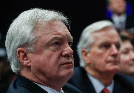 Britain's Secretary of State for Exiting the European Union David Davis (L) and European Union's chief Brexit negotiator Michel Barnier wait in a press room at the EC headquarters in Brussels, Belgium December 8, 2017. REUTERS/Yves Herman