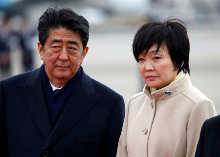 FILE PHOTO - Japan's Prime Minister Shinzo Abe (L) and his wife Akie at Haneda Airport in Tokyo, Japan February 28, 2017. REUTERS/Issei Kato/File Photo