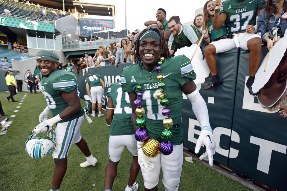 Tulane defensive back Jarius Monroe (11) celebrates after an NCAA college football game against Memphis in New Orleans, Saturday, Oct. 22, 2022. Tulane won 38-28. (AP Photo/Tyler Kaufman)