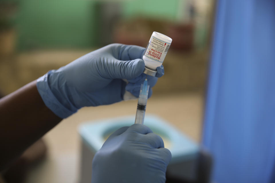 FILE - In this Tuesday, July 27, 2021 file photo, a medical worker prepares a shot of the Moderna vaccine during a vaccination campaign at Saint Damien Hospital in Port-au-Prince, Haiti. In late June, the international system for sharing coronavirus vaccines sent about 530,000 doses to Britain – more than double the amount sent that month to the entire continent of Africa. It was the latest example of how a system that was supposed to guarantee low and middle-income countries vaccines is failing, leaving them at the mercy of haphazard donations from rich countries. (AP Photo/Joseph Odelyn, file)