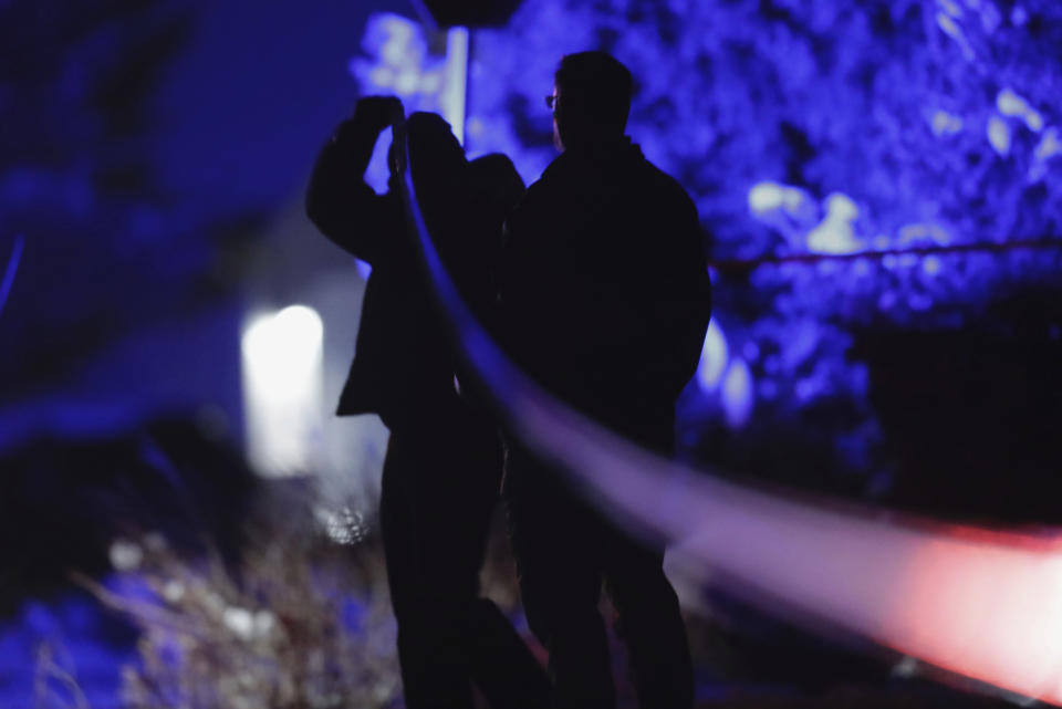 FILE - Law enforcement officials stand near the Enoch, Utah, home where eight family members were found dead from gunshot wounds, Wednesday, Jan. 4, 2023. The U.S. is setting a record pace for mass killings in 2023, replaying the horror in a deadly loop roughly once a week so far this year. (Ben B. Braun/The Deseret News via AP, File)