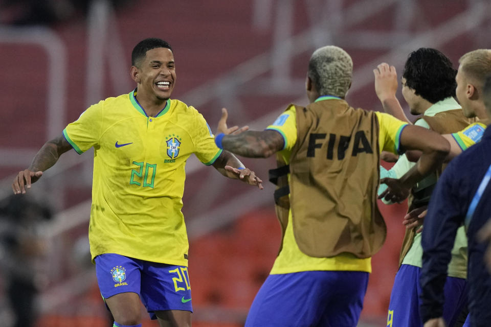 Brazil's Savio, left, celebrates with teammates after scoring his side's opening goal against Dominican Republic during a FIFA U-20 World Cup Group D soccer match at the Mendoza Stadium in Mendoza, Argentina, Wednesday, May 24, 2023. (AP Photo/Natacha Pisarenko)