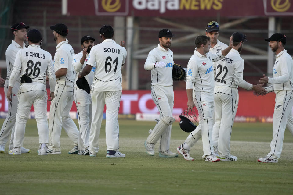 New Zealand's players shake hands with each others on the end of the third day play of the second test cricket match between Pakistan and New Zealand, in Karachi, Pakistan, Wednesday, Jan. 4, 2023. (AP Photo/Fareed Khan)