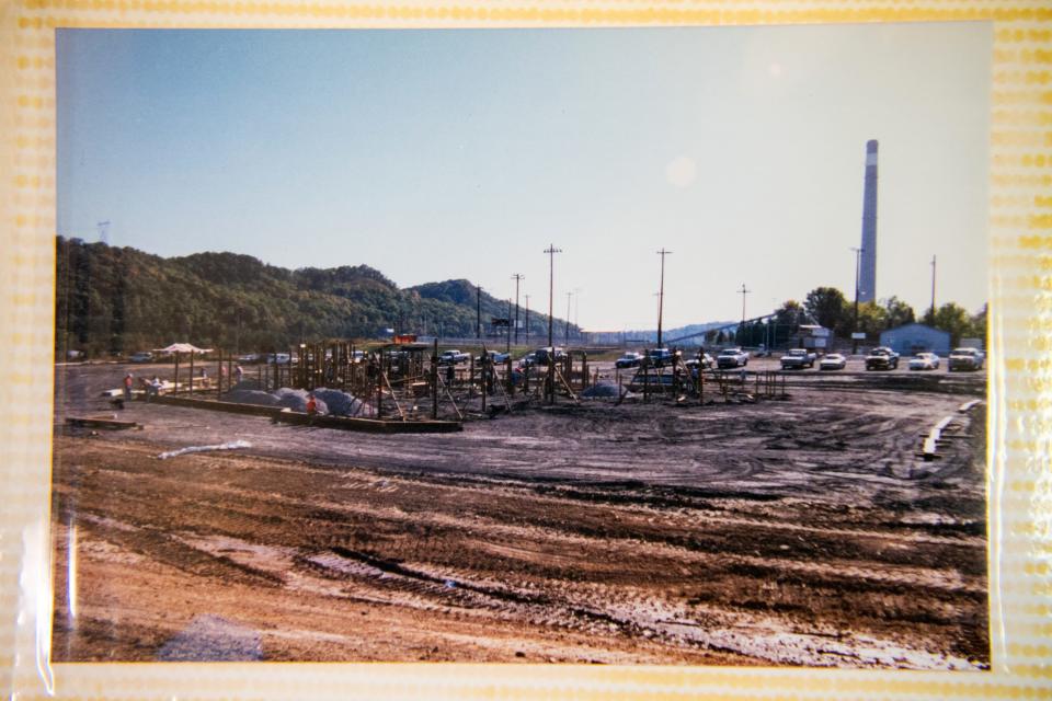 Photos of the preparation and construction of the Claxton Community Playground in 2000 are seen in a photo album kept at the Claxton Community Center on Wednesday, Jan. 18, 2023.