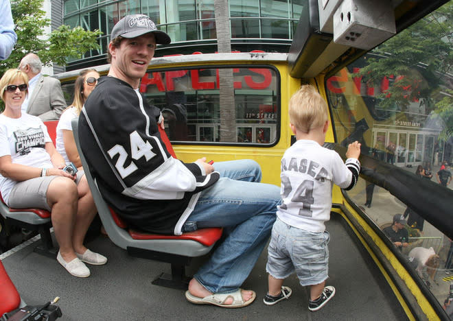 LOS ANGELES, CA - JUNE 14: Colin Fraser #24 of the Los Angeles Kings waits on the bus with his family prior to the Los Angeles Kings Stanley Cup Victory Parade on June 14, 2012 in Los Angeles, California. (Photo by Victor Decolongon/Getty Images)