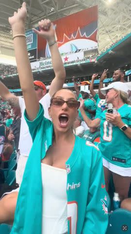 <p>alixearle/TikTok</p> Alix Earle supports Braxton Berrios at Sunday's Miami Dolphins game