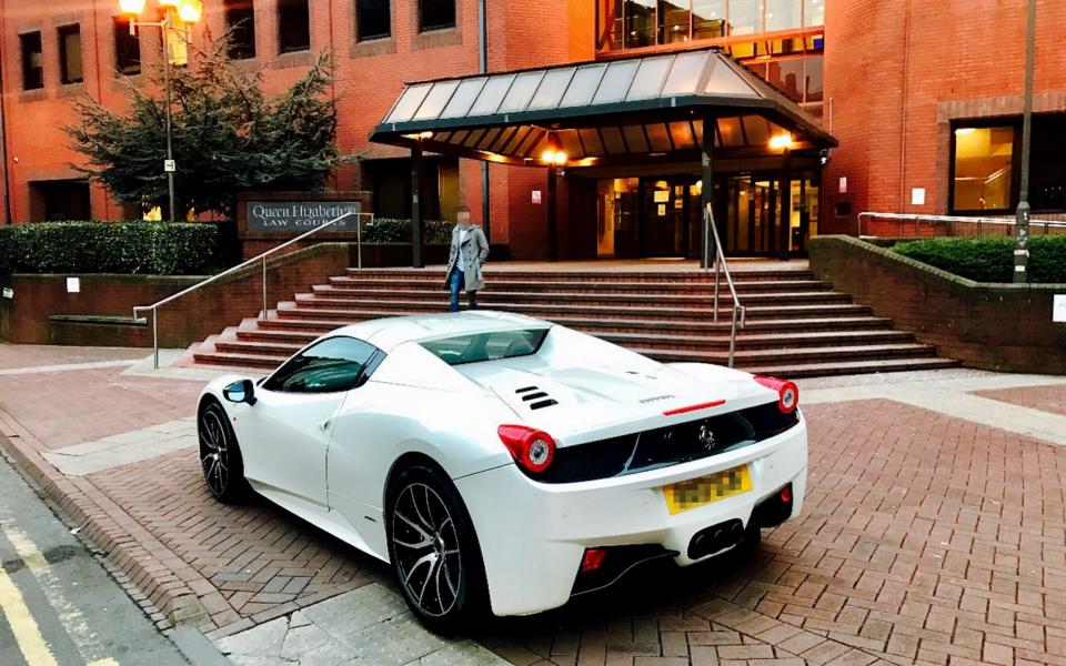 The Ferrari belonging to Zahid Khan parked outside Birmingham Crown Court - Credit: BPM MEDIA 