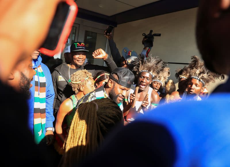 Former World Boxing Champion (WBC) Floyd Mayweather is greeted by fans upon his arrival at Robert Gabriel Mugabe International Airport in Harare