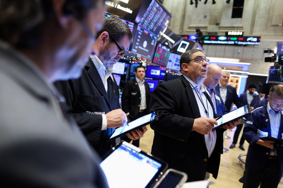 Traders work on the trading floor at the New York Stock Exchange (NYSE) in New York City, U.S., January 5, 2023. REUTERS/Andrew Kelly