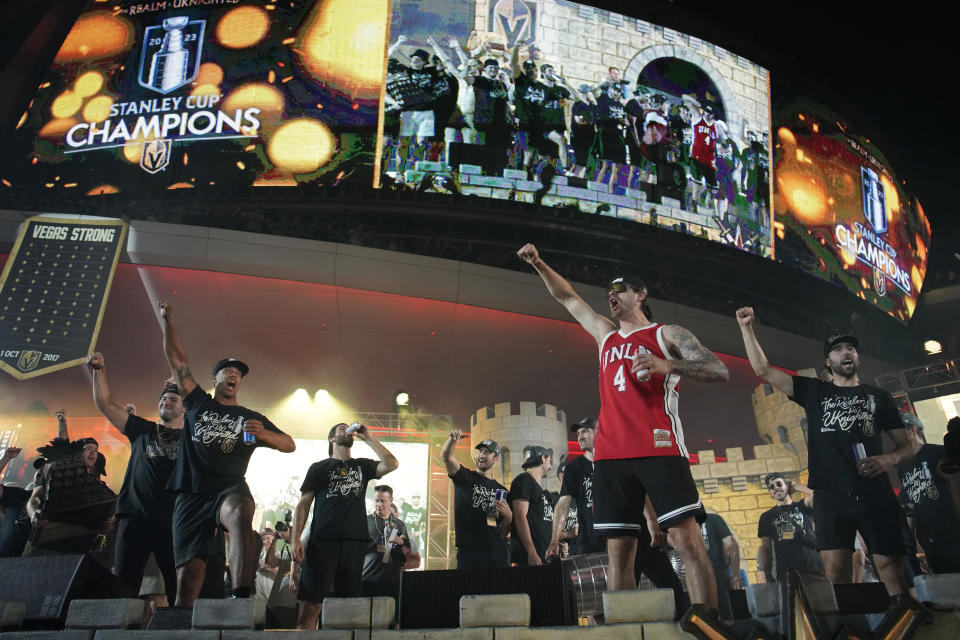 Vegas Golden Knights celebrate during a rally after a parade along the Las Vegas Strip for the NHL hockey champions Saturday, June 17, 2023, in Las Vegas. (AP Photo/John Locher)