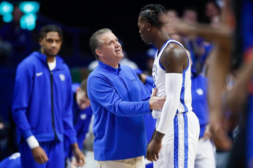 Kentucky head coach John Calipari talks with forward Chris Livingston during Saturday’s game against Florida.