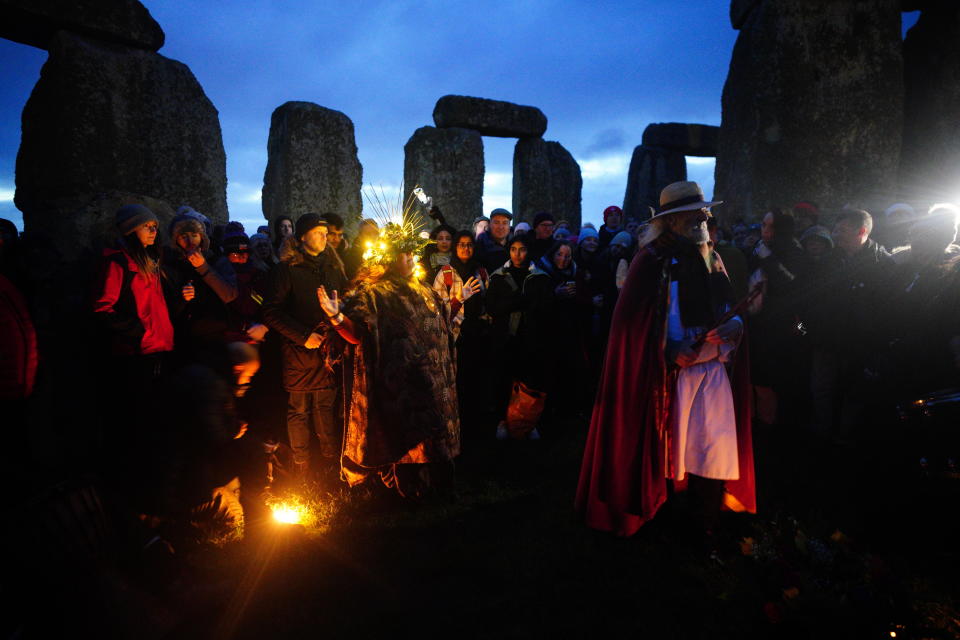 People take part in winter solstice celebrations at the prehistoric Stonehenge monument on Salisbury Plain in Wiltshire, England on December 22, 2023. / Credit: Ben Birchall/PA Images via Getty Images