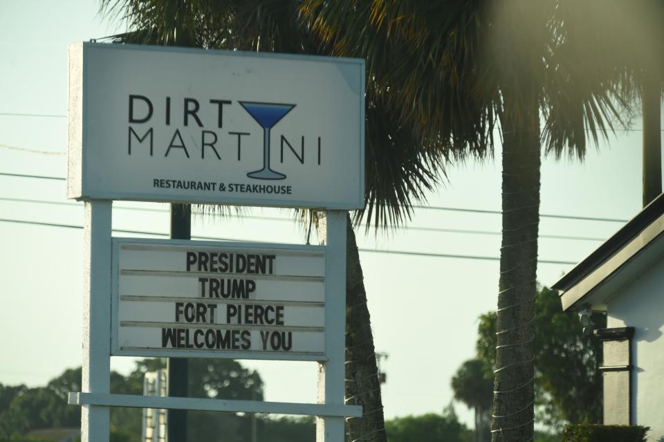 A sign in front of Dirty Martini Restaurant & Steakhouse in Fort Pierce, Fla., welcomes President Donald Trump to town on Tuesday, July 18, 2023. While a pretrial hearing for Trump and codefendant Waltine "Walt" Nauta was scheduled that day at the Alto Lee Adams Sr. U.S. Courthouse, neither defendant was expected to be in attendance.