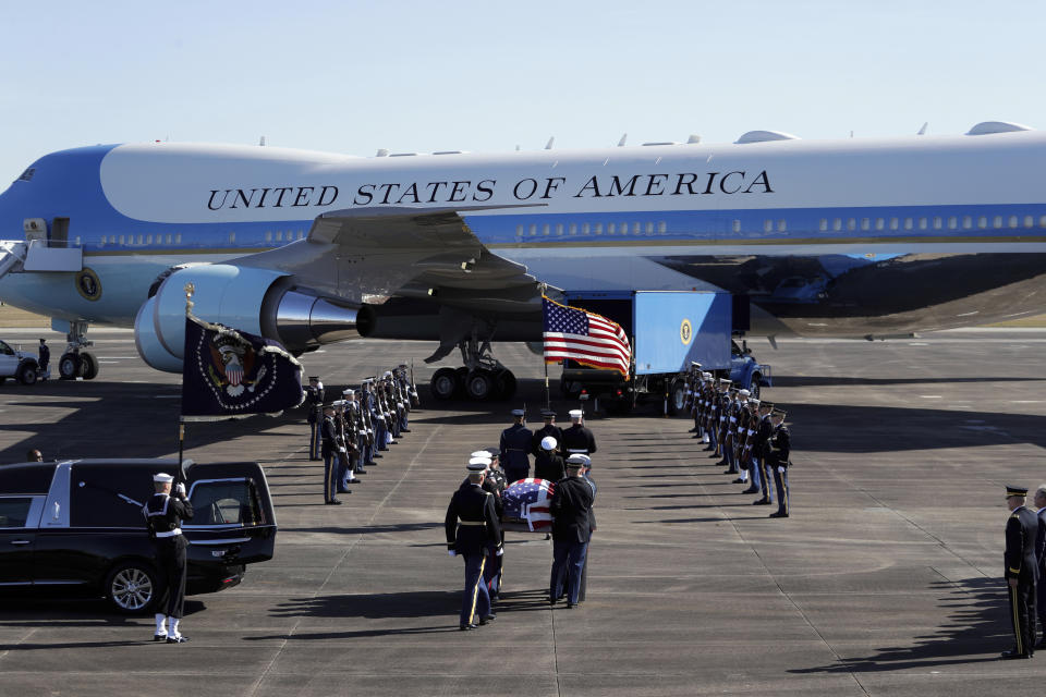 Members of the military carry the casket to Special Air Mission 41at Ellington Field during a departure ceremony for a state funeral for former President George H.W. Bush, Monday, Dec. 3, 2018, in Houston. (Photo: Eric Gay/AP)