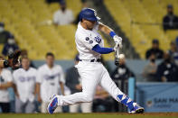 Los Angeles Dodgers' Austin Barnes connects for a three-run home run during the ninth inning of a baseball game against the Los Angeles Dodgers Friday, May 28, 2021, in Los Angeles. (AP Photo/Marcio Jose Sanchez)