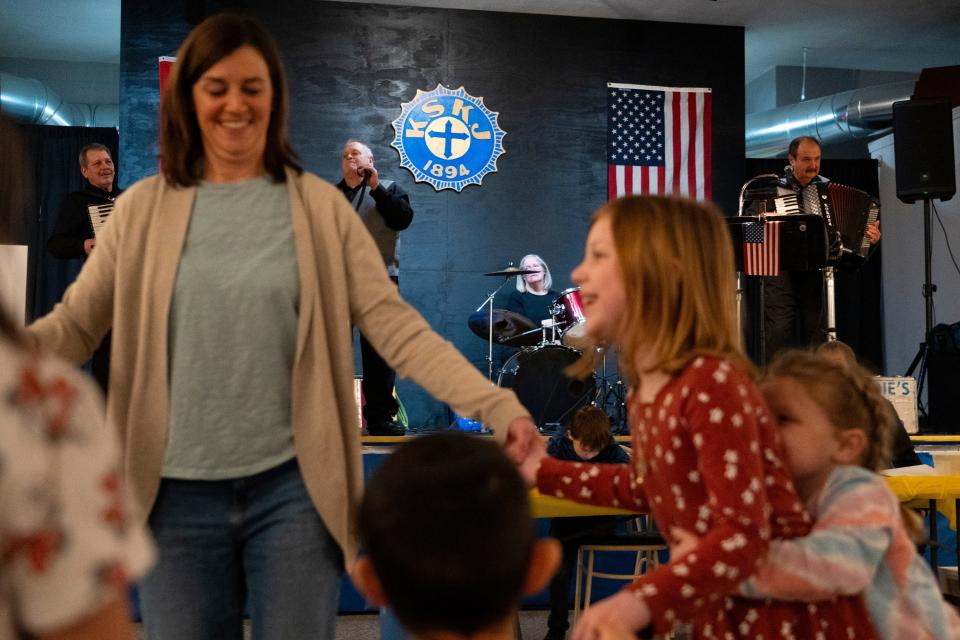 Guests dance while Eddie Korosa Jr. and his Boys and Girl from Illinois perform live polka music Saturday, Jan. 27, 2024, during the 26th Annual St. AlÕs Sausage Festival at the Slovenian National Home in Indianapolis.