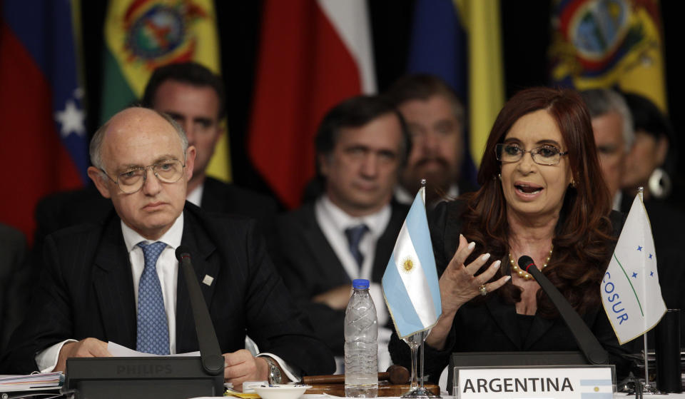 Argentina's President Cristina Fernandez, right, speaks as her Foreign Minister Hector Timerman looks on during a Mercosur summit in Mendoza, Argentina, Friday, June 29, 2012. Fernandez announced that the Mercosur trade bloc will not slap economic sanctions on Paraguay after the removal of its president because they felt it would hurt the Paraguayan people. Mercosur leaders criticized the impeachment and barred President Fernando Lugo's replacement, former Vice President Federico Franco, from attending the summit. (AP Photo/Natacha Pisarenko)