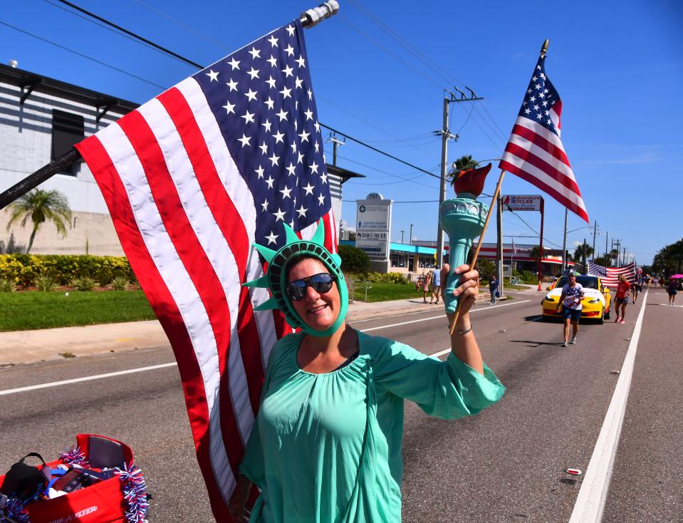 People lined North Courtenay Parkway during the Merritt Island Fourth of July parade on Monday morning. The parade featured a large Brevard County Sheriff's Office presence, local businesses, civic and veterans groups, and numerous politicians.