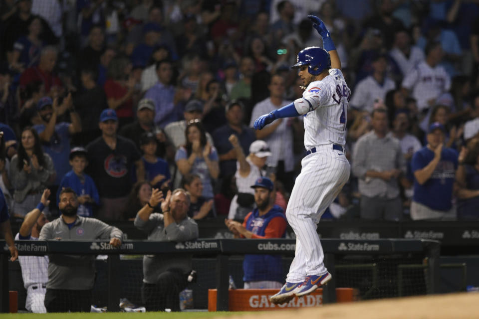 Chicago Cubs' Willson Contreras celebrates while rounding third base after hitting a two-run home run during the fifth inning of the team's baseball game against the Cincinnati Reds on Wednesday, June 29, 2022, in Chicago. (AP Photo/Paul Beaty)