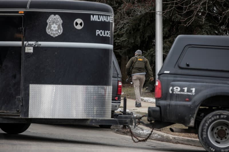 Police investigate a shooting at the Molson Coors headquarters in Milwaukee, Wisconsin