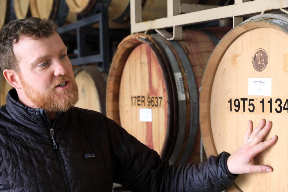 Ian Bearup, the winemaker at Millbrook Vineyards & Winery talks about the winemaking process while in the barrel room at the winery on February 22, 2024.