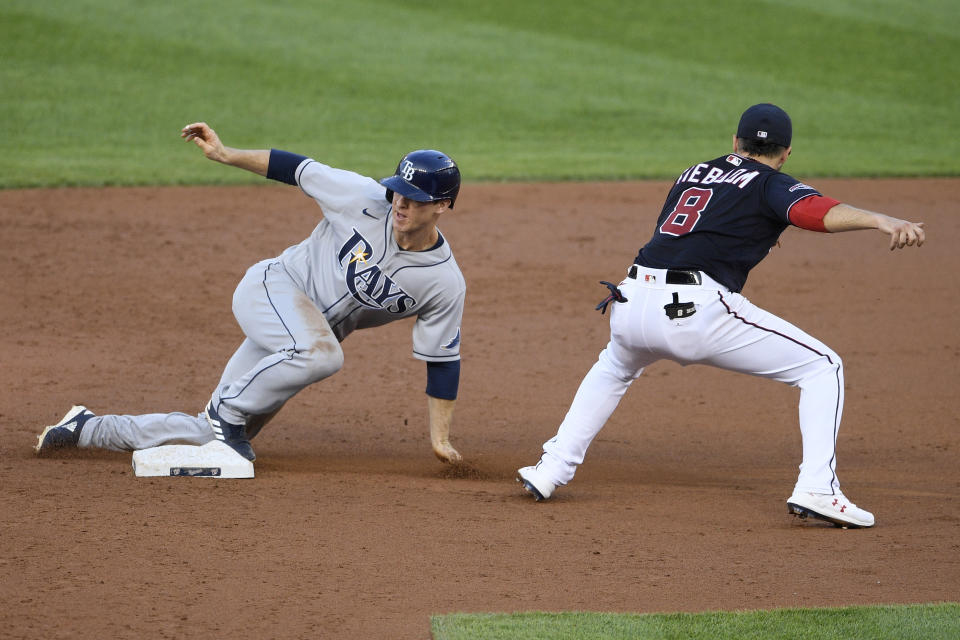 Tampa Bay Rays' Joey Wendle, left, steals second past Washington Nationals third baseman Carter Kieboom (8) during the third inning of a baseball game, Monday, Sept. 7, 2020, in Washington. (AP Photo/Nick Wass)