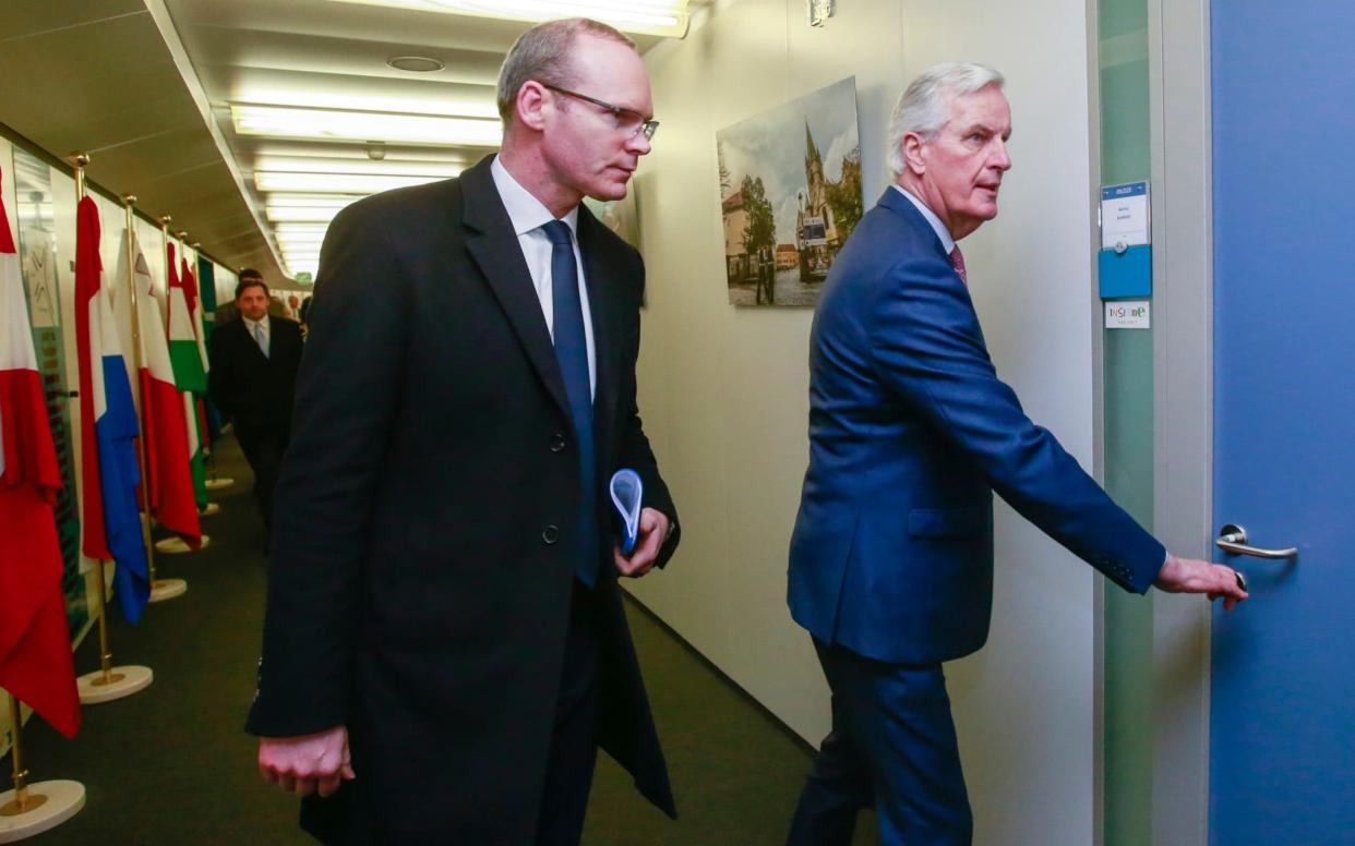 European Union chief Brexit negotiator Michel Barnier, right, prepares to meet with Irish Foreign Minister Simon Coveney  - POOL EPA