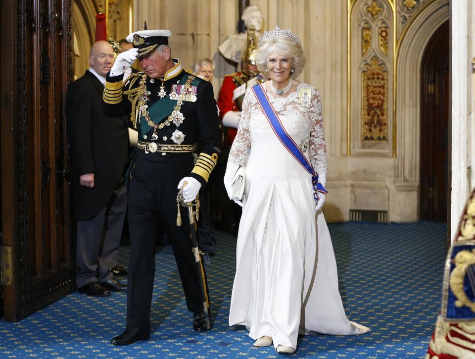 Britain's Prince Charles, left, and Camilla, The Duchess of Cornwall as they leave after the State Opening of Parliament, at the Houses of Parliament in London, Wednesday, May 8, 2013. The State Opening of Parliament marks the formal start of the parliamentary year, the Queen delivered a speech which set out the government's agenda for the coming year. (AP Photo/Kirsty Wigglesworth, Pool)