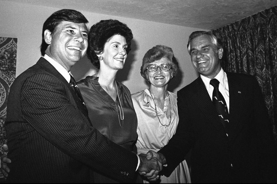 FILE- In this Nov. 7, 1978, file photo, Democratic gubernatorial candidate Bob Graham, left, poses with his running mate Wayne Mixson, right, of Marianna, in Miami, while looking at election returns. In the center next to their husbands are Adele Graham and Margie Mixson. Mixson, a former Florida governor whose three-day term was shortest in state history, died Wednesday, July 8, 2020. He was 98. Mixson took over the top spot on Jan. 3, 1987, when Gov. Bob Graham resigned early to be sworn into the U.S. Senate. Mixson was a two-term lieutenant governor. (AP Photo/Jim Bourdier, File)