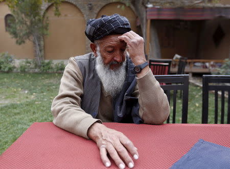 Former Guantanamo Bay detainee Mohammed Zahir speaks during an interview at his work place in Kabul, Afghanistan November 19, 2015. REUTERS/Ismail Azami