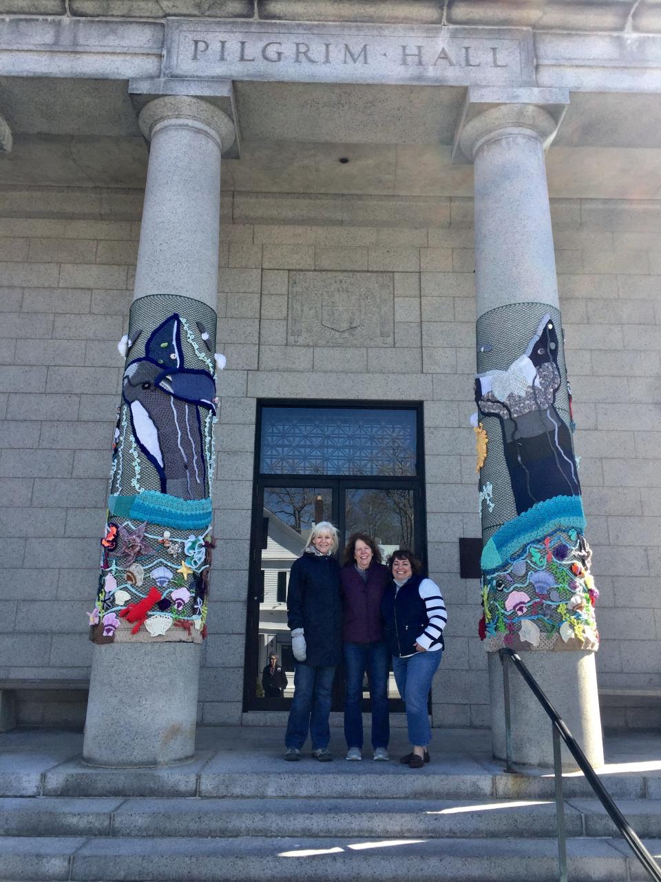 The pillars of Pilgrim Hall Museum are decorated with sea creatures for a public art display called Yarn Pop.