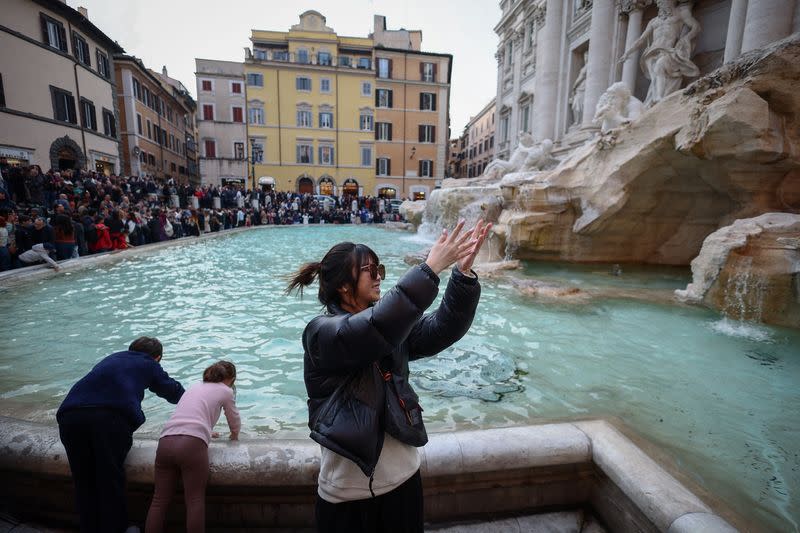 The Wider Image: What happens to the coins tossed into Rome's Trevi Fountain?