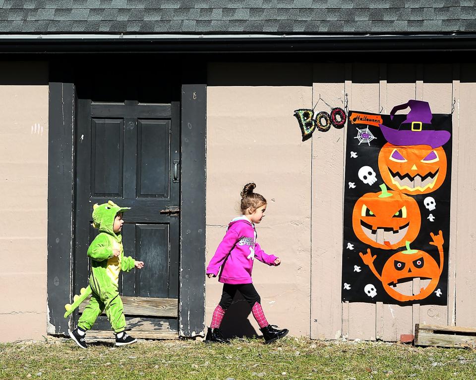Connor Burkart and his cousin Arabella Wolfram, both of Weymouth, explore Weir River Farm in Hingham during last year's Boo in the Barnyard event.