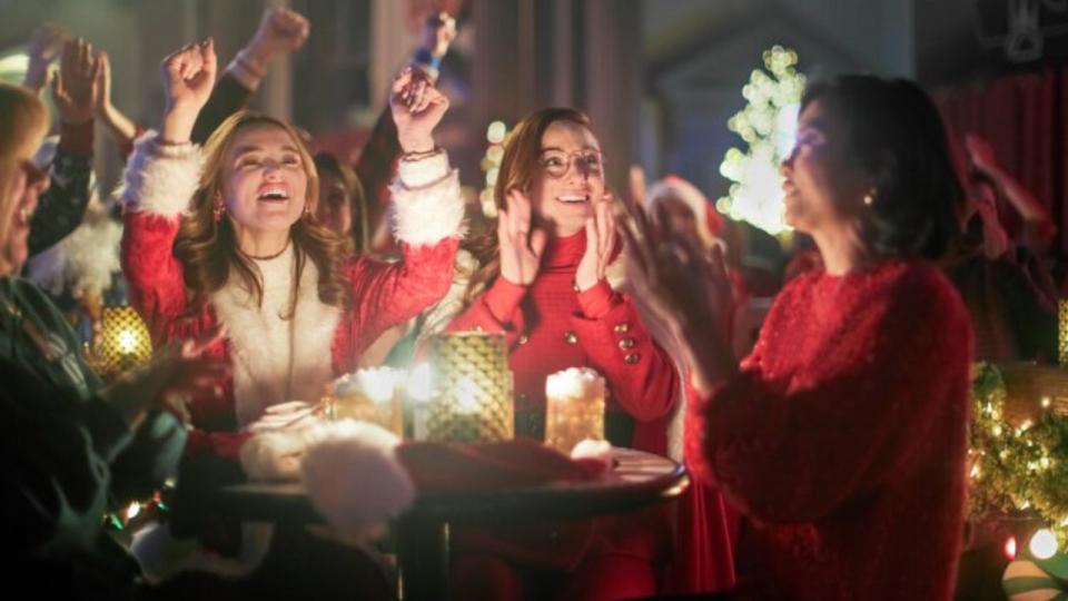 The ladies in The Santa Summit celebrating at a table